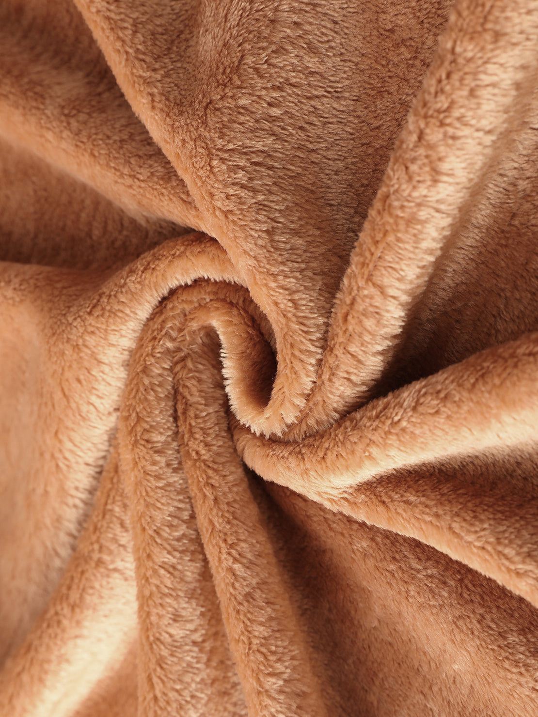Close-up of soft plush faux fur fabric in light brown for open front oversized fur jacket