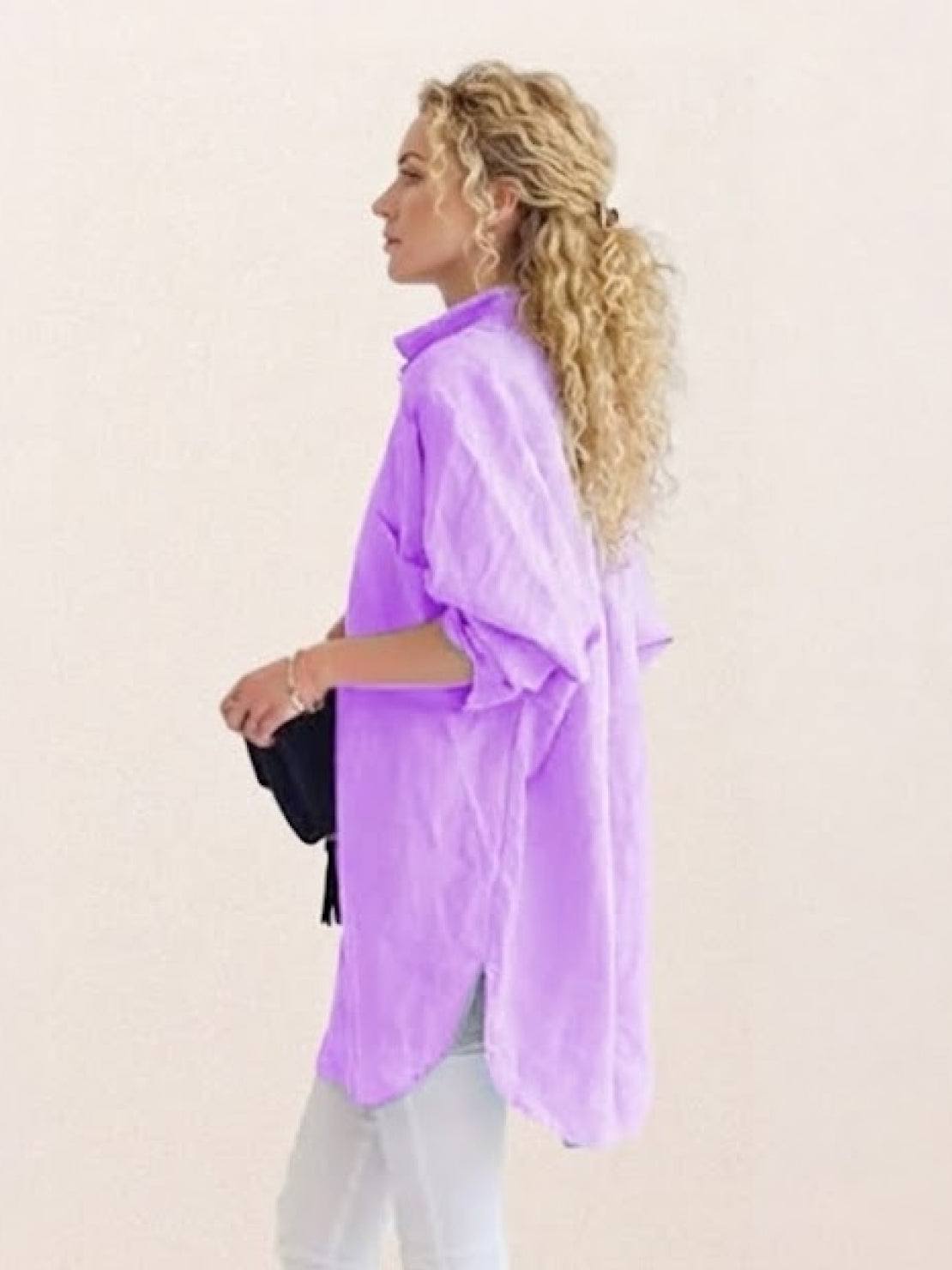 Oversized linen shirt made from breathable cotton-linen blend with relaxed fit and back button details