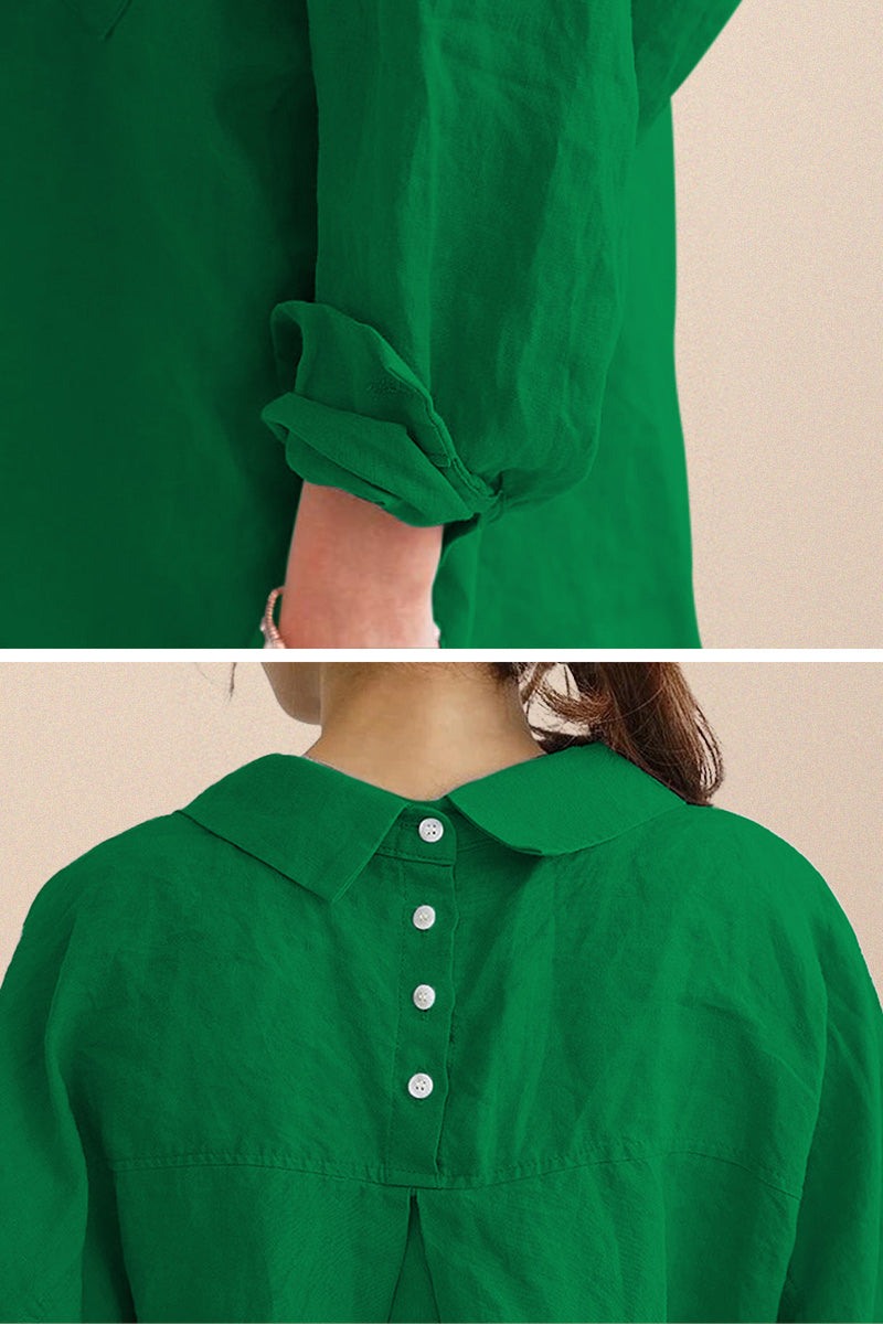 Close-up of green oversized linen shirt with rolled sleeves and back button detailing