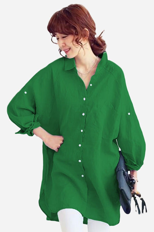 Oversized linen shirt in green with relaxed fit and button front, breathable cotton-linen blend, styled with long sleeves and flowing hem.