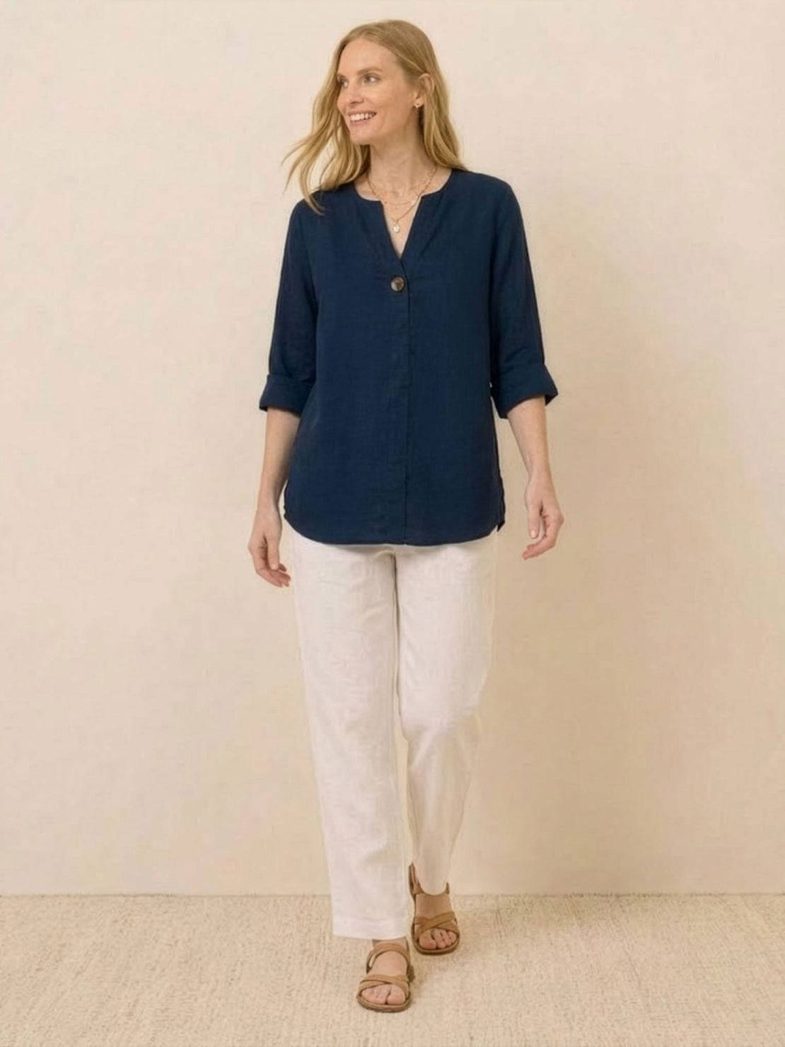 Close-up of pure linen age-defying shirt with button detail and breathable fabric texture
