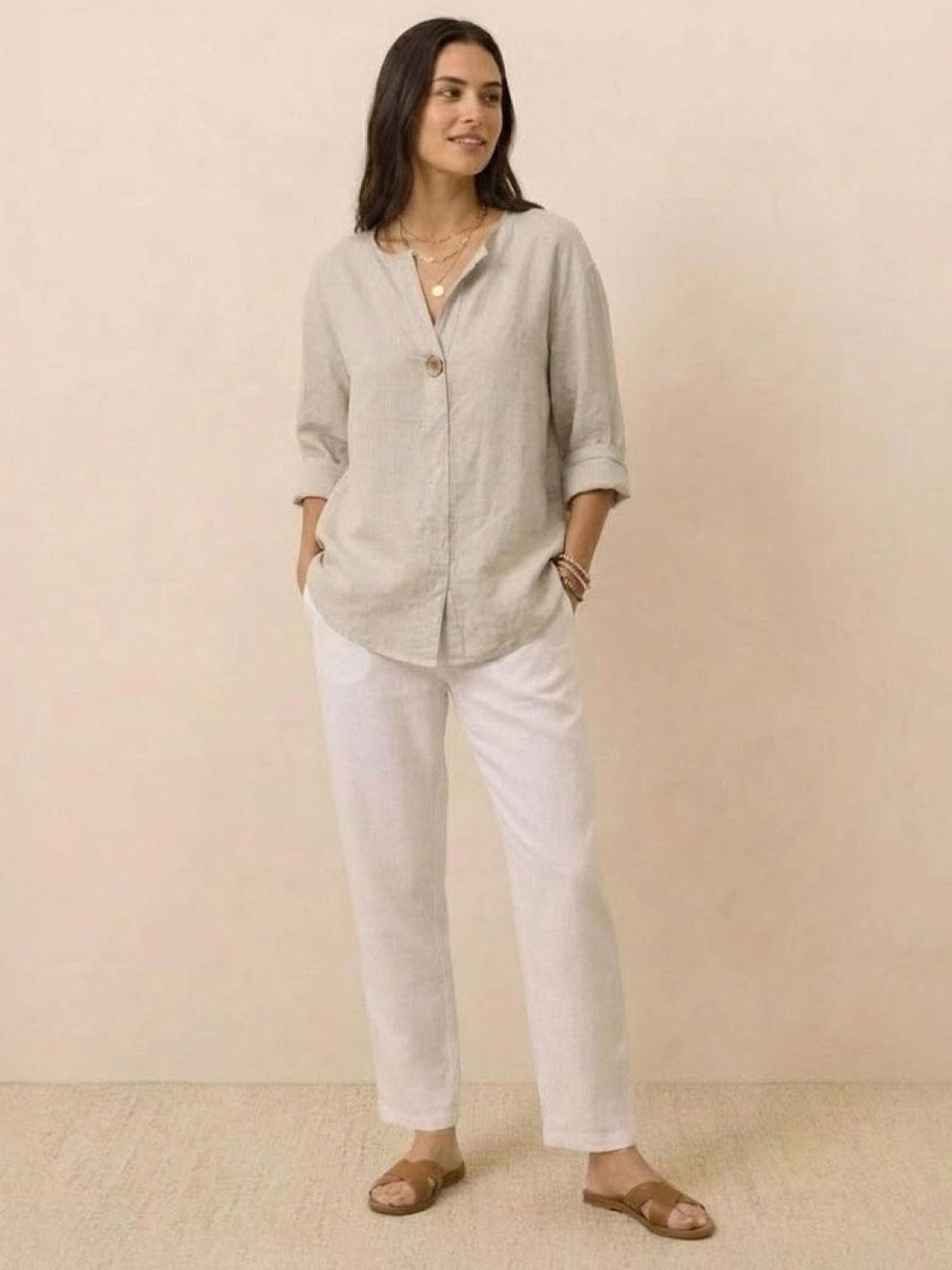 white pure linen age-defying button detail shirt on hanger against white background