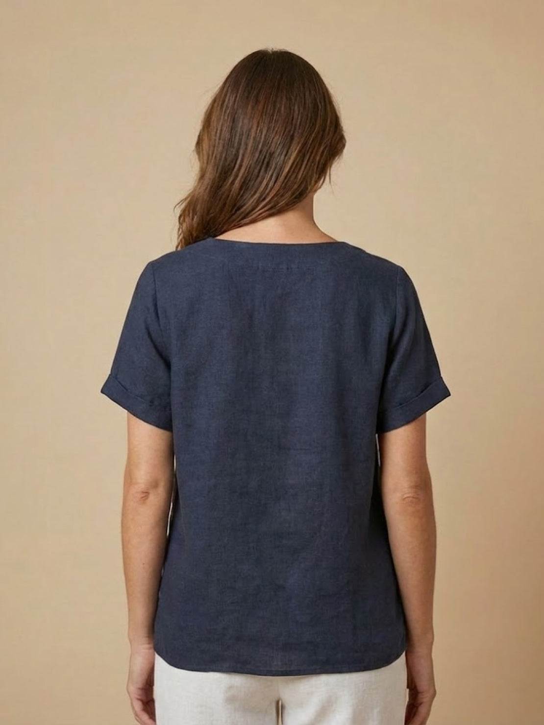 Relaxed fit linen button-up tee with breathable cotton, short sleeves, and stylish button detail.