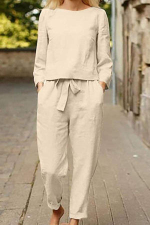 Woman wearing relaxed cotton-linen monochrome longline top and wide-leg pants set on street