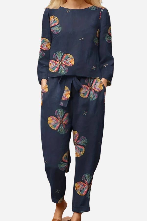Retro patterned linen two-piece set with colorful floral design on navy fabric, breathable cotton linen blend.