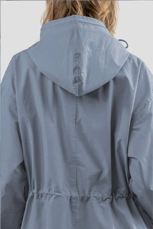 Back view of a light blue Rain Couture Windbreaker with an adjustable hood and cinched waist, made from water-resistant fabric.