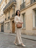 Elegant women's golden hour set in premium cotton linen blend with embroidered V-neck top and wide-leg trousers