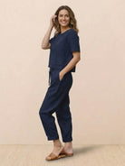 Woman wearing relaxed 100% cotton linen co-ord set with short-sleeve top and straight-leg pants in monochrome tones