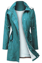 Women's teal water resistant striped windbreaker rain jacket with hood and adjustable waist