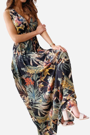 Woman wearing a casual sleeveless dress with colorful floral print and v-neck design