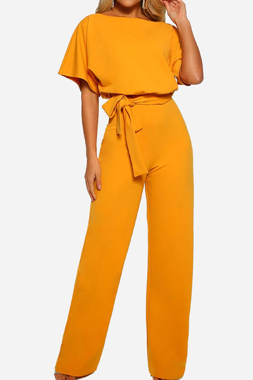 Chic short-sleeved wide-leg jumpsuit in vibrant yellow with waist belt and elegant fit