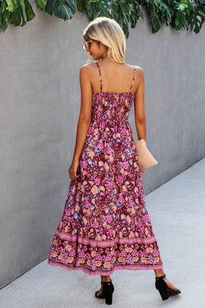 woman wearing vintage flower prints maxi dress with spaghetti straps and elastic waist walking outdoors