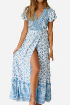 Bohemian floral print wrap dress with V-neck and high slit in blue and white cotton fabric
