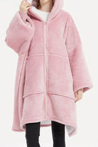 Pink oversized ultra soft hooded blanket with zipper and large front pockets for warmth.