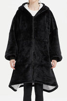 Oversized ultra soft hooded blanket with zipper and front pockets in black flannel sherpa material