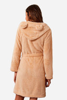 Back view of woman wearing beige premium comfort nightgown bathrobe with animal ear hood and belt detail