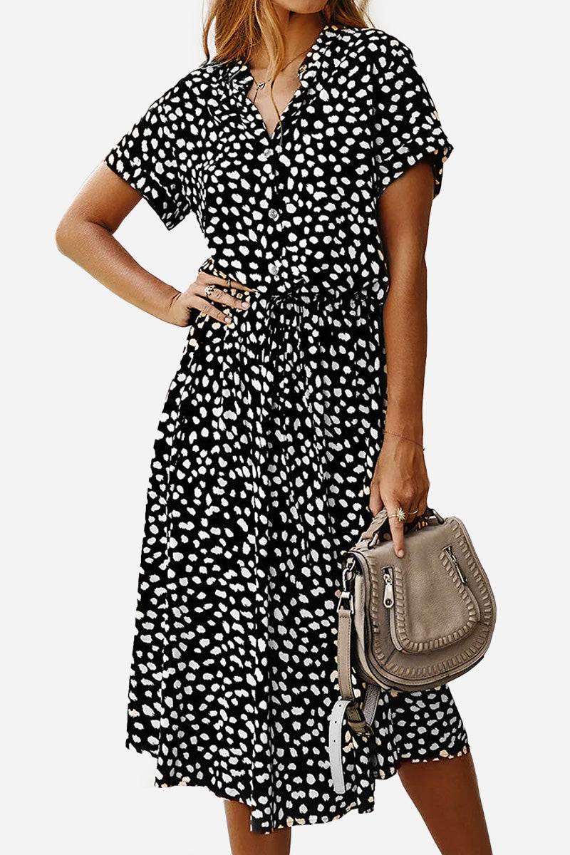 Casual bohemian dress skirt with black and white dot print, lace-up waist, short sleeves, and midi length.