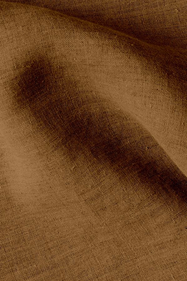 Close-up of brown cotton linen fabric texture showing breathable Retro Monochrome Linen material