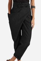 Black high-waist wrapped pants with loose fit and side pocket for comfortable stylish wear
