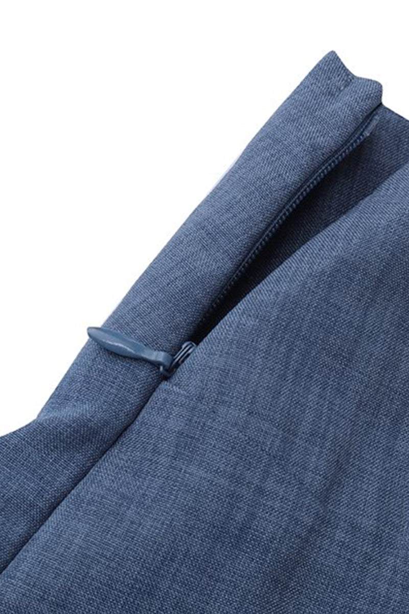 Close-up of blue high-waist wrapped pants fabric and detail with tie belt fastening