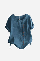 Relaxed fit linen button-up tee in blue with short sleeves and stylish button detail