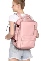 Chic Wanderlust Waterproof Backpack in pink worn by woman showing ergonomic design and multiple compartments