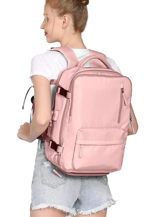 Chic Wanderlust Waterproof Backpack in pink worn by woman showing ergonomic design and multiple compartments