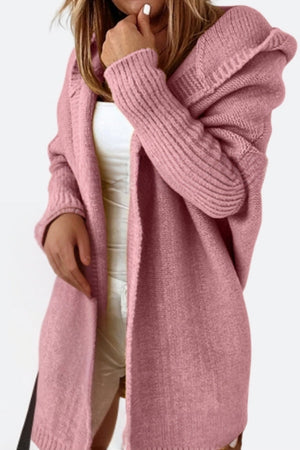 Pink warm oversized hooded cardigan with ribbed sleeves and relaxed fit on a model