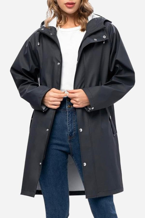 Lightweight ultra water-resistant long black windbreaker jacket with hood and slim fit design for women