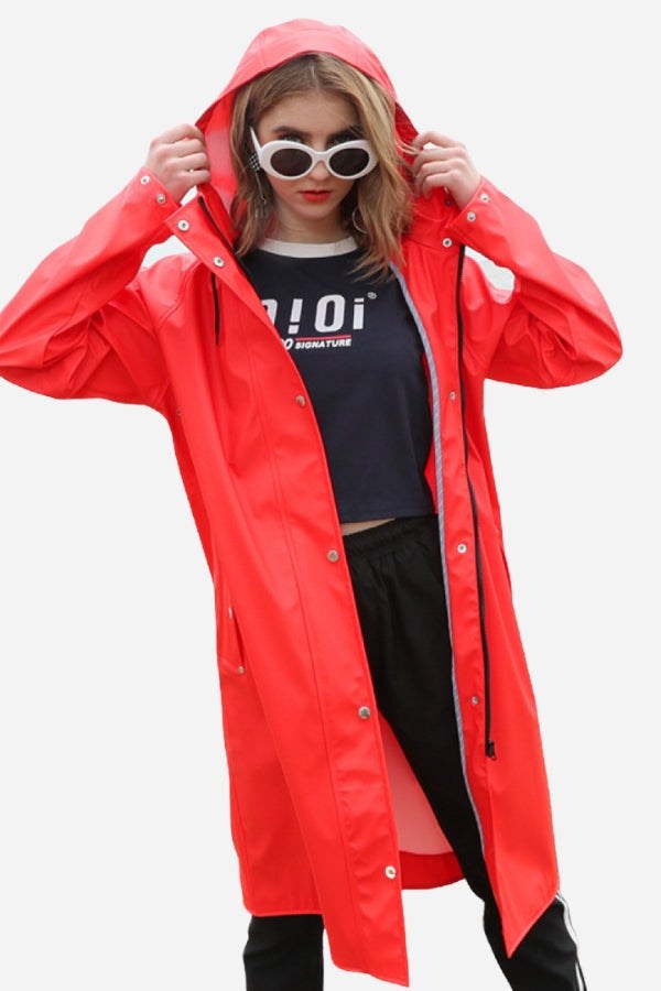 Lightweight ultra water-resistant red long windbreaker jacket with hood worn by woman
