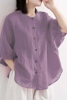 Relaxed loose breathable linen blouse in soft purple with button-down front and 3/4 sleeves for casual summer wear