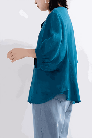 Relaxed loose breathable linen blouse in vibrant blue with long sleeves and casual fit