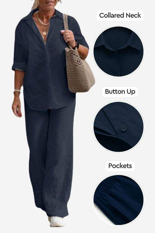 Woman wearing navy relaxed shirt and trousers two-piece set with collared neck, button-up front, and pockets, styled casually with a knitted handbag and white shoes
