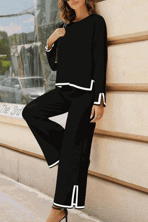 Long sleeved relaxed fit black lounge two-piece set with white trim and wide-leg pants for casual chic style