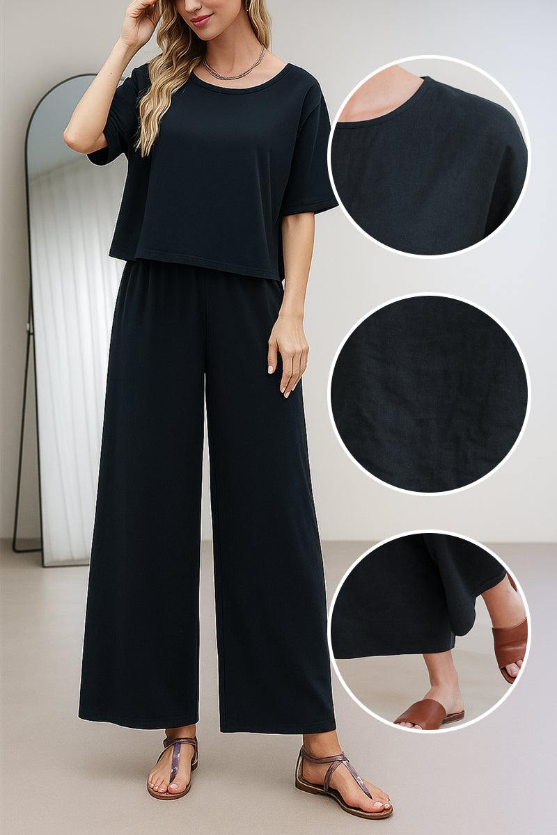 Black loose fit co-ord set with relaxed short sleeve top and wide-leg trousers in soft, breathable fabric.