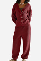 Woman wearing a relaxed fit two-piece knitwear set in deep red with button-up cardigan and matching knit pants