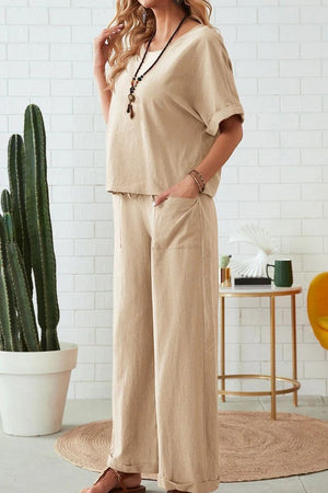 Woman wearing beige rolled cuff top and patch pocket pants set in relaxed fit