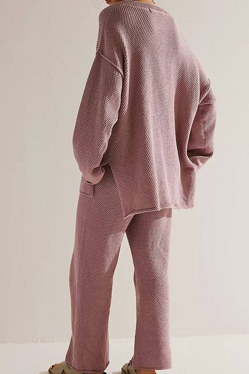 Back view of woman wearing dusty pink textured two-piece oversized set for multi-weather comfort