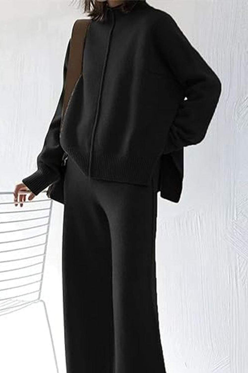 Black high neck sweater and wide leg pant set with relaxed fit and center seam detail