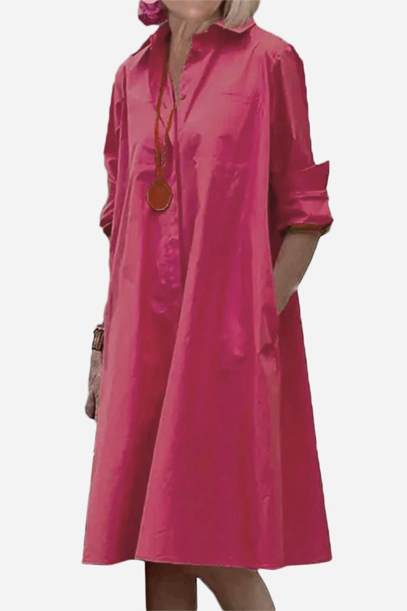 Pink long shirt-style dress with rolled sleeves and a relaxed fit