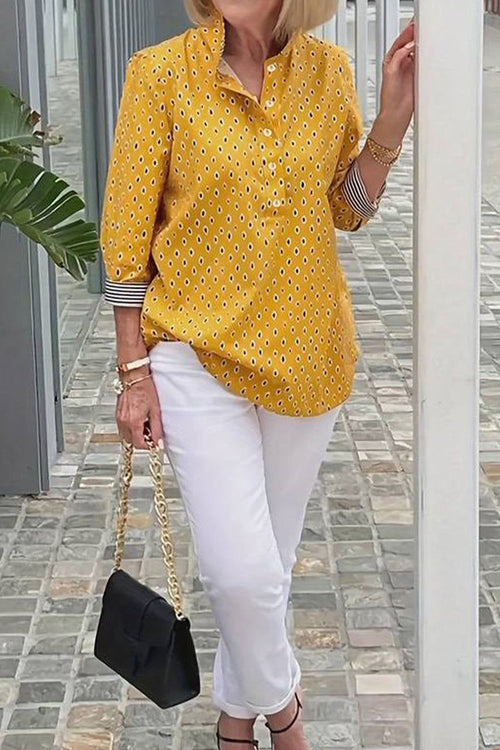 Boho Chic Resort Blouse yellow polka dot lightweight blouse with striped cuffs and collar styled with white pants and black handbag