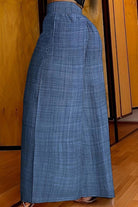 High waist wide leg pants in lightweight blue fabric with elastic waistband and relaxed fit