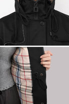 Elegant Plaid Raincoat Windbreaker with black exterior and plaid interior lining, featuring draw-string waist and water-resistant fabric.