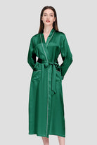 Woman wearing green 100% mulberry silk belted classy nightgown with long sleeves and pockets
