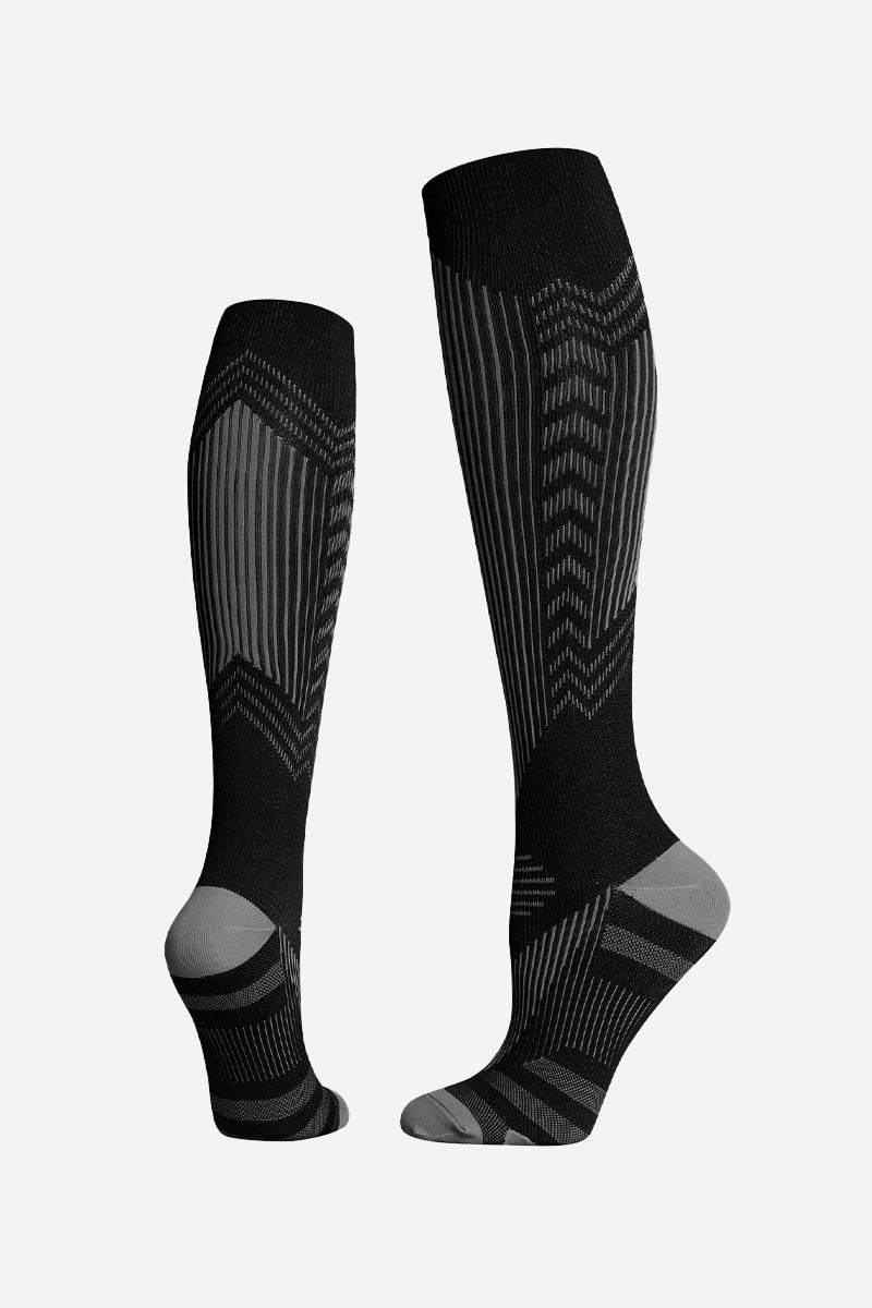 black premium compression travel socks with gray accents and gradual compression design
