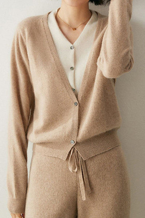 Woman wearing beige single-breasted cashmere wool cardigan and matching pants