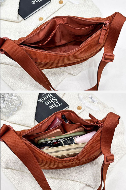 Brown corduroy shoulder bag with adjustable strap and spacious zippered interior compartments