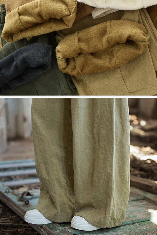Folded sandwashed ramie linen pants in earth tones and close-up of wide-leg fit with white sneakers outdoors
