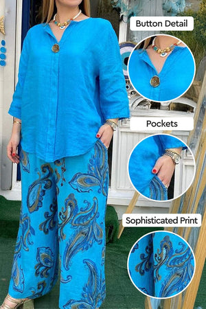 Vibrant Fusion Two-Piece Set with blue button-up top and paisley print wide-leg pants, featuring button detail and pockets.