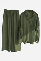 Olive green cotton-linen two-piece set with relaxed shirt and wide-leg pants.